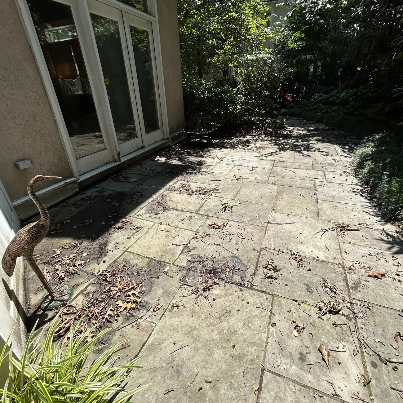 Before: Flagstone patio, pressure washed