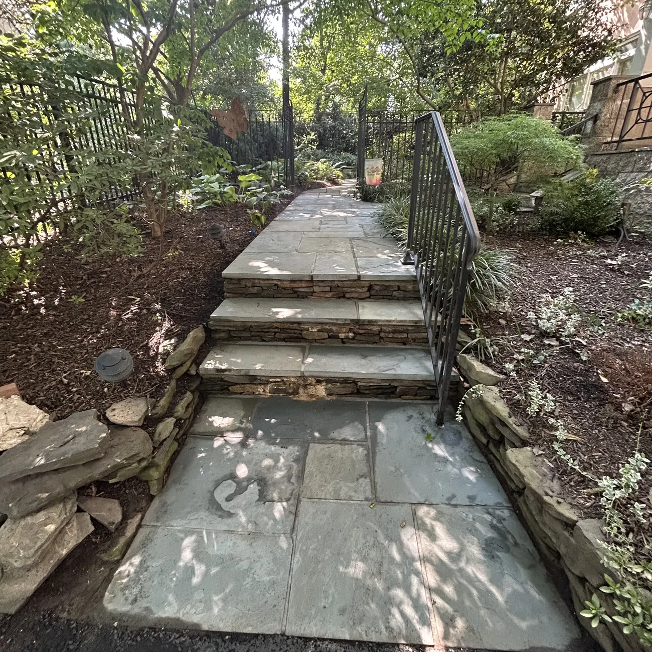 After: Stone steps and beds, leaves cleared and fresh mulch laid